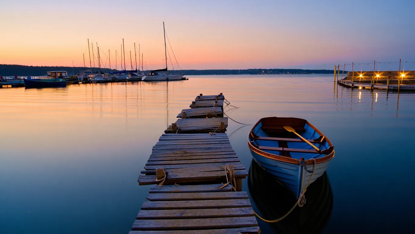 Serene evening water scene with soft ambient lighting and calm ripples